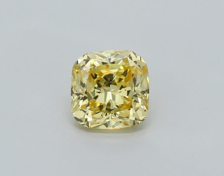 0.52 carat, Colour – Y6  Fancy Intense Yellow, Clarity – VVS1, Shape – Modified Cushion,  BDM