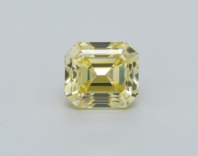 0.76 carat, Colour – Y5  Fancy Intense Yellow, Clarity – VVS1, Shape – Rectangular Emerald,  BDM