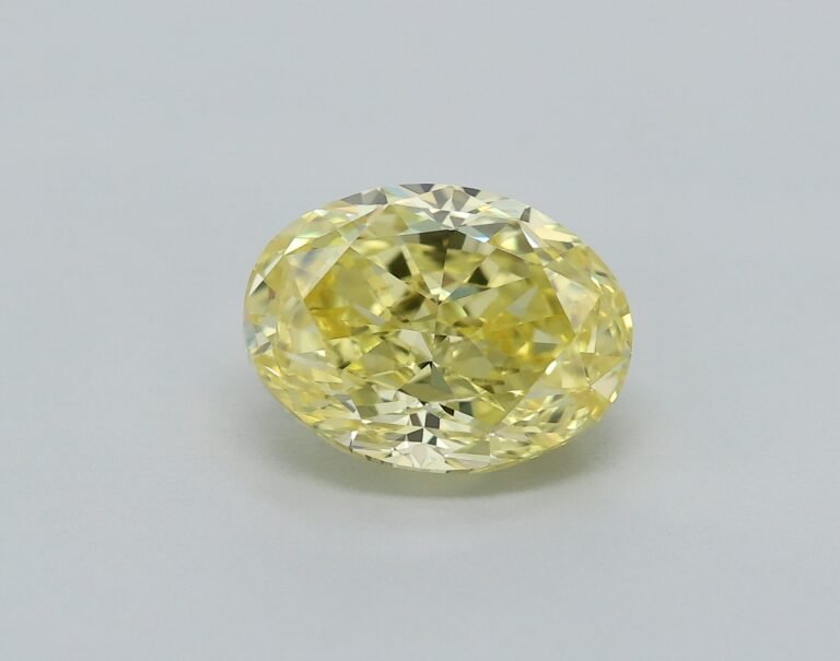0.78 carat, Colour – Y5  Fancy Intense Yellow, Clarity – VVS2, Shape – Modified Oval,  BDM