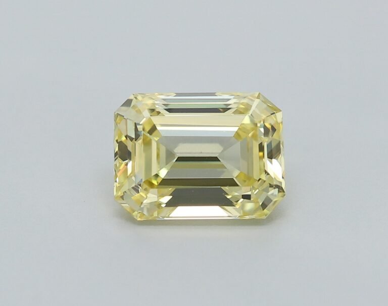 0.58 carat, Colour – Y5  Fancy Intense Yellow, Clarity – VS1, Shape – Rectangular Emerald,  BDM